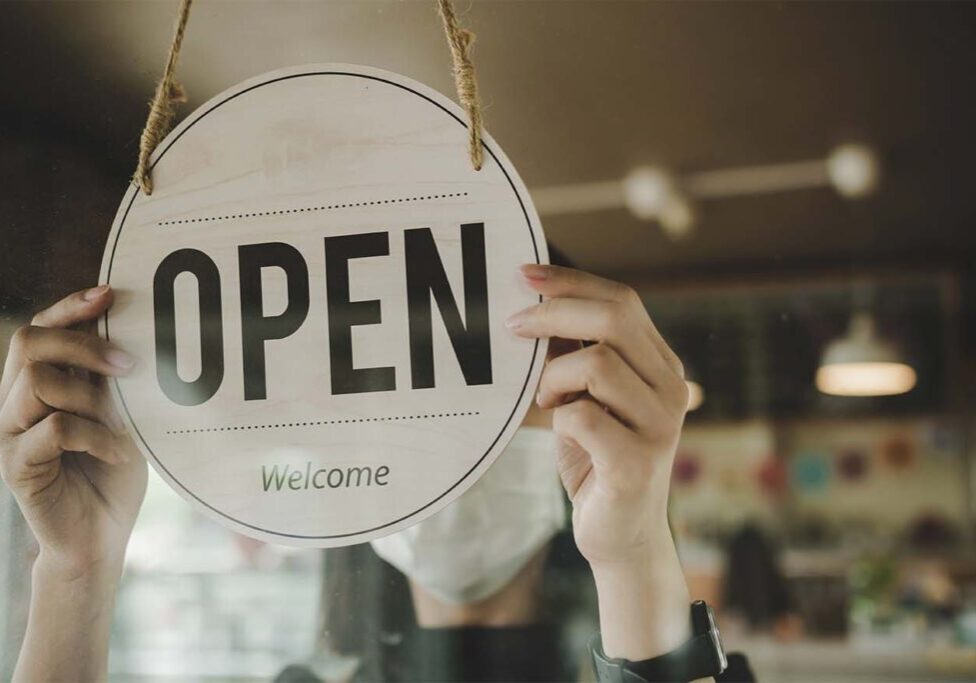 Open.,Barista,,Waitress,Woman,Wearing,Protection,Face,Mask,Turning,Open Open. barista, waitress woman wearing protection face mask turning open sign board on glass door in modern cafe coffee shop, cafe restaurant, retail store, small business owner, food and drink concept